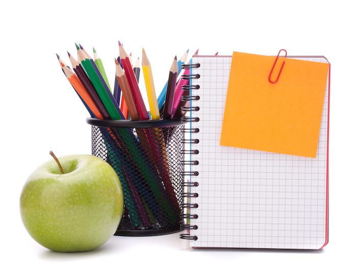 blank notebook sheet and apple.